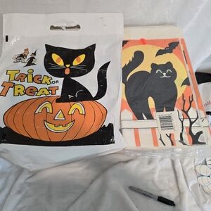 Vintage Trick or treat bag and a sealed halloween paper tablecloth